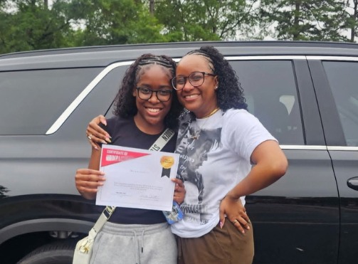 Drive Smart Academy graduate Jaycie Santana holding a certificate of completion